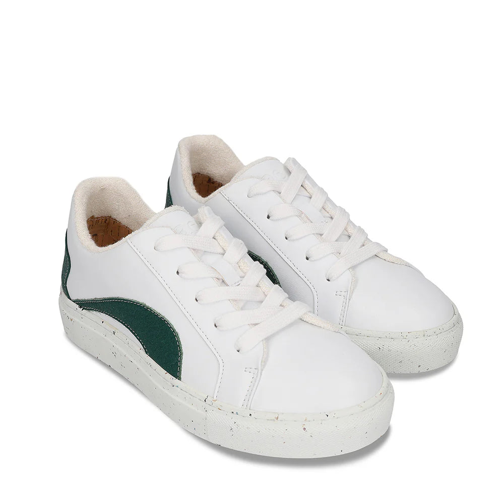 White sneakers with green accents on a white background