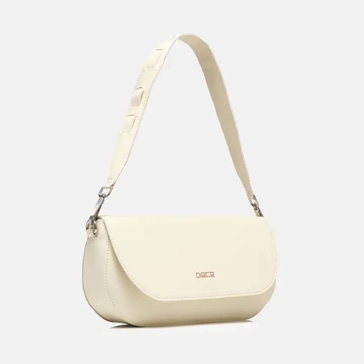 Cream-colored handbag logo on a light gray background.  plant based ivory leather bad made from apple peels.  Classic shoulder bag with fold-over design